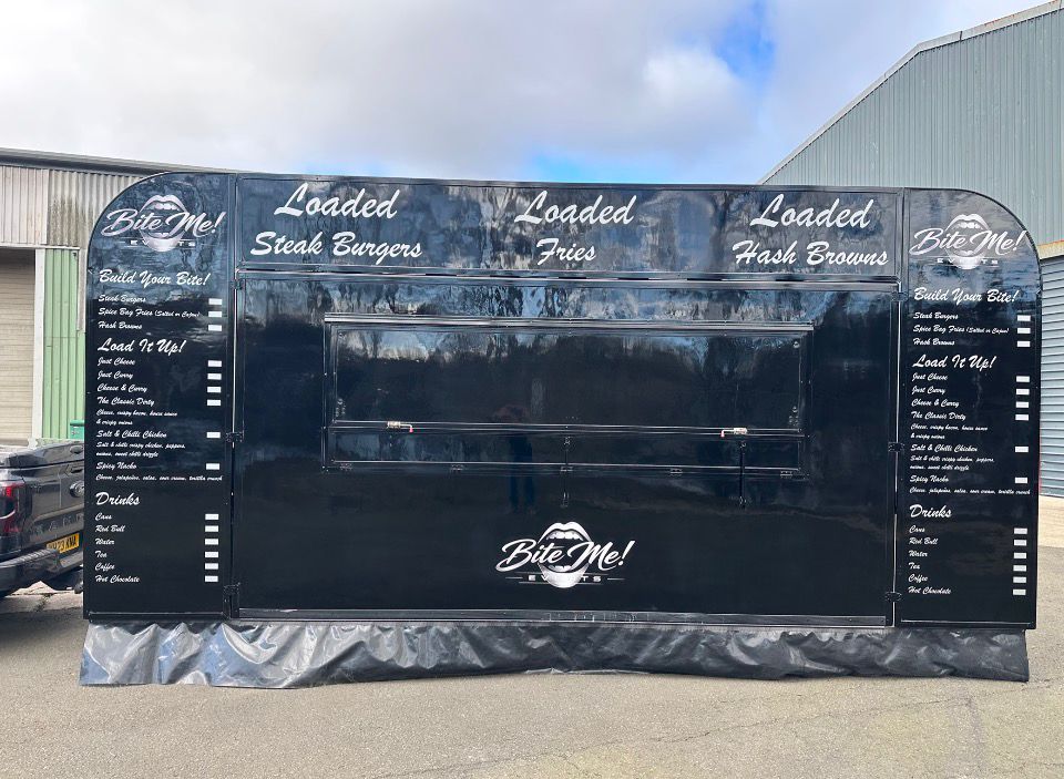 Bite Me food truck serving customers at an outdoor event
