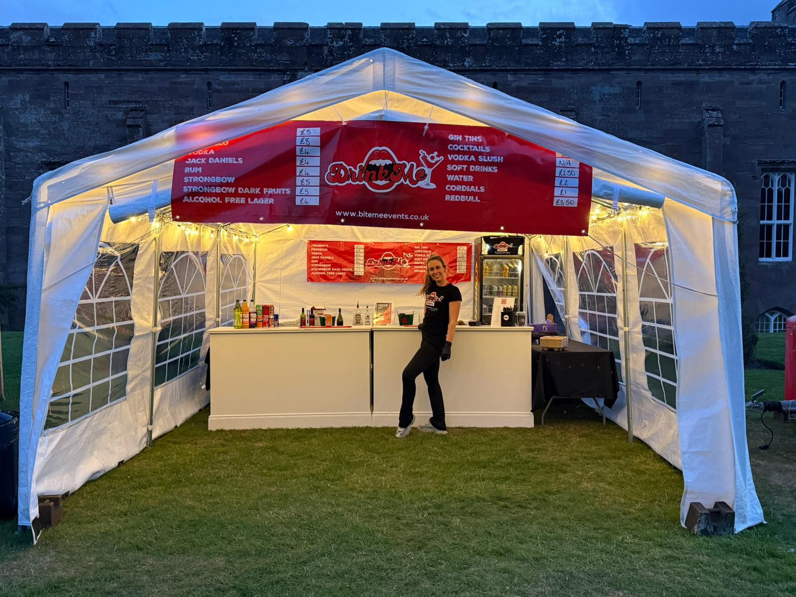 Drink Me pop-up bar at dusk with fairy lights